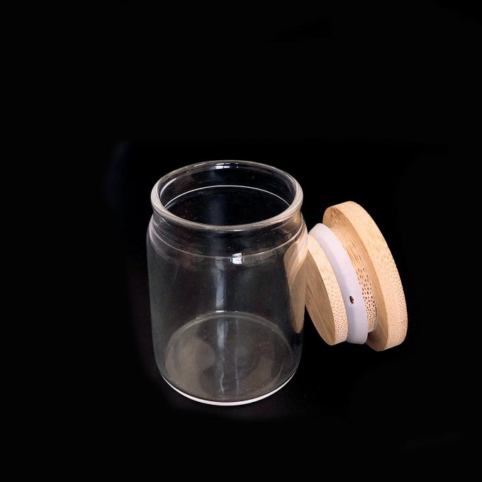 Un barattolo di vetro sigillato di gomma di 2 4 6 8 dell'oncia degli alimenti termoresistenti della caramella del coperchio contenitori di stoccaggio stretti di legno dell'aria con il coperchio di bambù